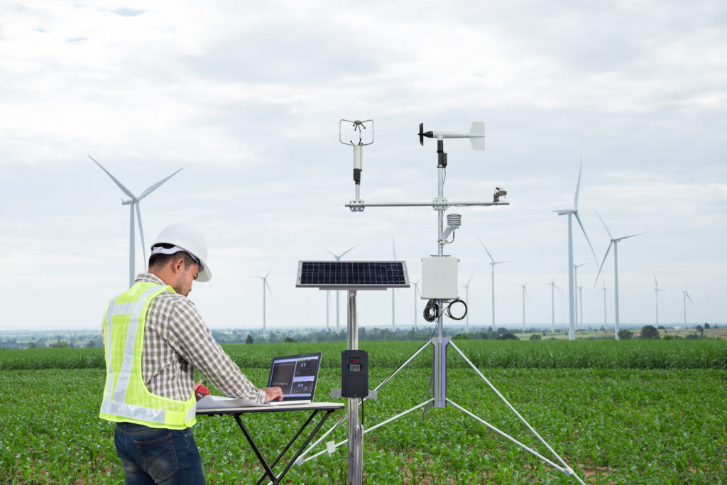 Engineer collecting data windmill