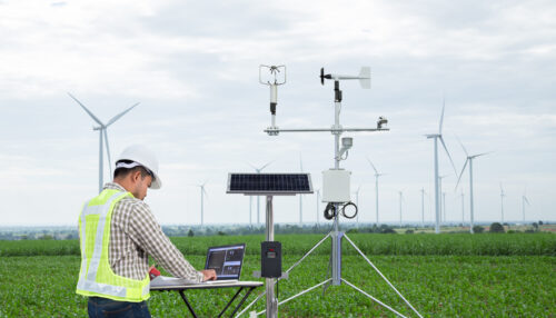 Engineer collecting data windmill