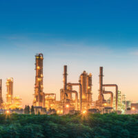 Landscape of Oil Refinery Plant and Manufacturing Petrochemical at Twilight Sunset Scenic View, Industry of Power Energy and Chemical Petroleum Product Factory. Building of Chemical Production Line Refinery oil and gas plant at twilight.
