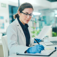 Woman in Lab Coat