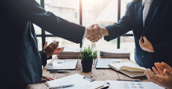 Business people shaking hands to congratulate success. Business executives handshake to congratulate the joint business agreement.