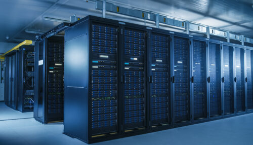 Shot of Modern Data Center With Multiple Rows of Operational Server Racks. Modern High-Tech Database Super Computer Clean Room.