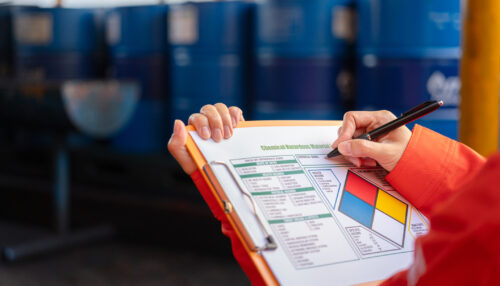 Checking on the chemical hazardous material form. Industrial safety working.