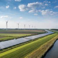 Solar panels and wind turbines generating renewable energy for green and sustainable future.