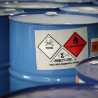 In barrels in a factory.