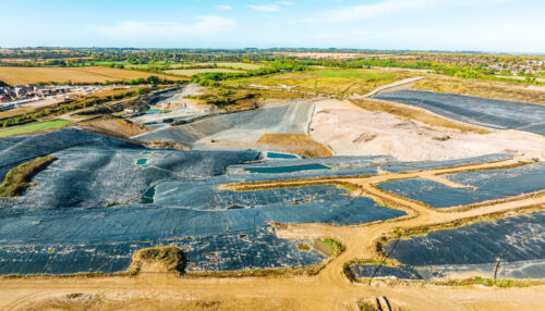 Landfill at a country side. Aerial view of a crowded ash dump