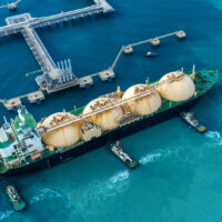 LNG (Liquefied natural gas) tanker anchored in Gas terminal gas tanks for storage. Oil Crude Gas Tanker Ship. LPG at Tanker Bay Petroleum Chemical or Methane freighter export import transportation LNG (Liquefied natural gas) tanker anchored in Gas terminal gas tanks for storage. Oil Crude Gas Tanker Ship. LPG at Tanker Bay Petroleum Chemical or Methane freighter export import transportation