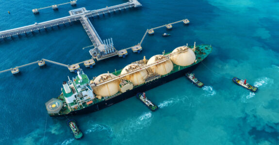 LNG (Liquefied natural gas) tanker anchored in Gas terminal gas tanks for storage. Oil Crude Gas Tanker Ship. LPG at Tanker Bay Petroleum Chemical or Methane freighter export import transportation LNG (Liquefied natural gas) tanker anchored in Gas terminal gas tanks for storage. Oil Crude Gas Tanker Ship. LPG at Tanker Bay Petroleum Chemical or Methane freighter export import transportation