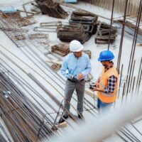 Stock-Employees-Men talking-PPE-Rebar-Construction Site 1 Stock-Employees-Men talking-PPE-Rebar-Construction Site 1